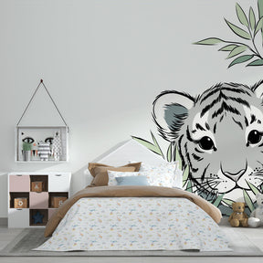 Tropical tiger wallpaper creating adventurous kids bedroom with natural wood furniture