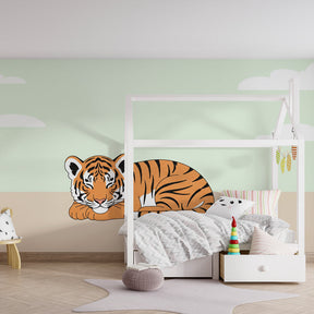 Orange and black striped tiger mural wallpaper bringing wildlife magic to kids playroom space