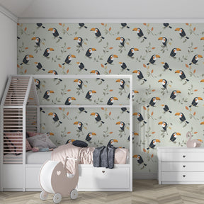 Colorful toucan bird wallpaper creating jungle themed children's bedroom with pastel background