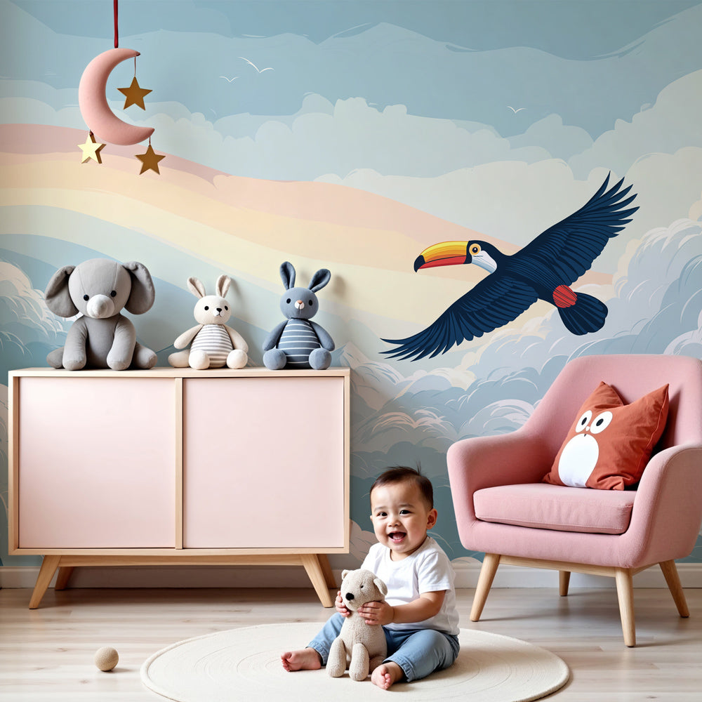 Toucan flying above rainbow clouds mural wallpaper in modern nursery room by Kids-Mundo