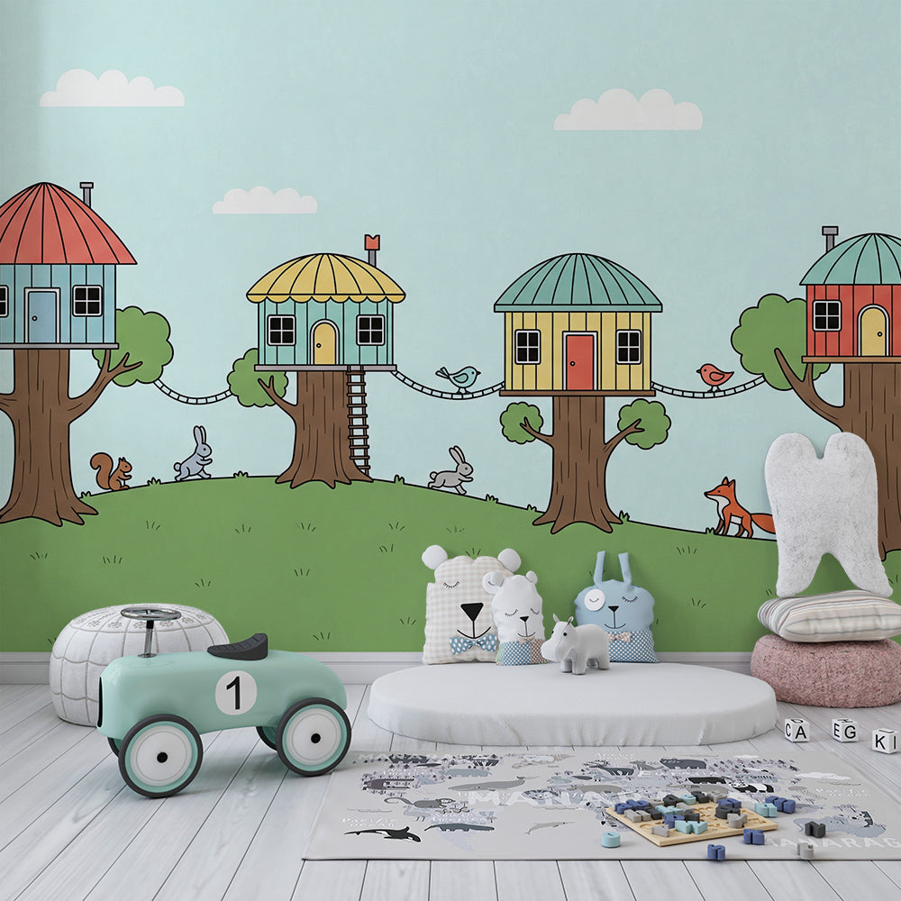 Kids-Mundo whimsical treehouse wall mural behind a bed in a child's woodland bedroom.