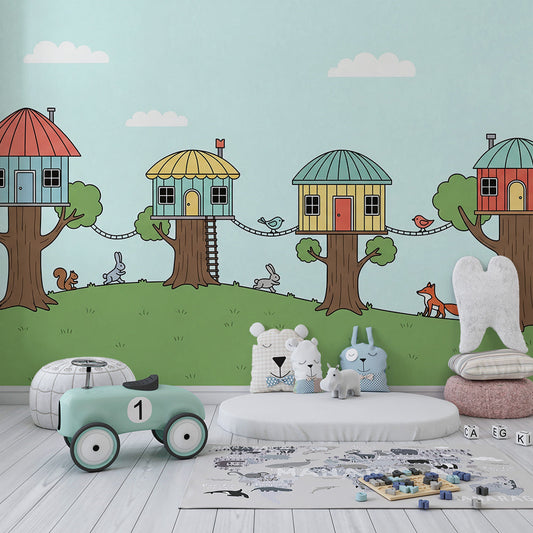 Kids-Mundo whimsical treehouse wall mural behind a bed in a child's woodland bedroom.