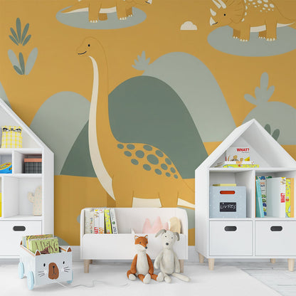 Kids-Mundo dinosaur hills mural on a kids bedroom wall behind a bed and cushions
