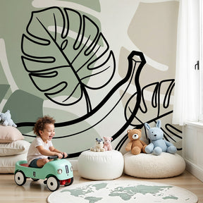 Tropical banana mural wallpaper with exotic leaves decorating modern nursery by Kids-Mundo