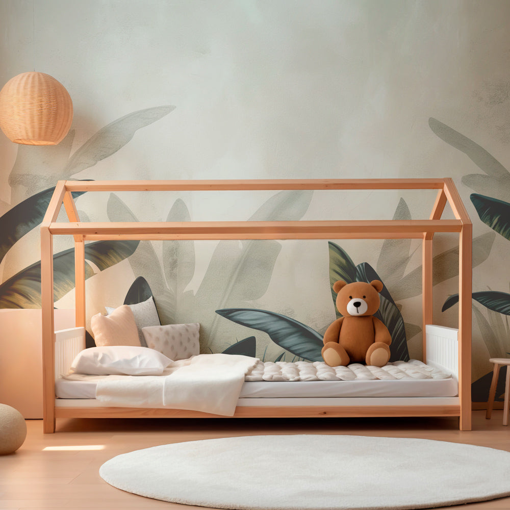 Green tropical foliage wallpaper in modern kids bedroom with natural lighting