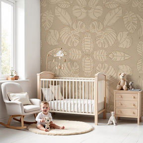 Tropical leaves mural wallpaper in beige creating serene nursery decor by Kids-Mundo