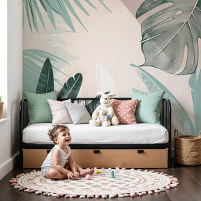 Tropical leaves mural wallpaper in soft pastels decorating modern nursery by Kids-Mundo