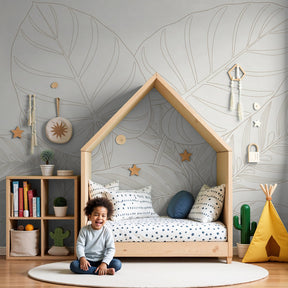 Tropical leaves mural wallpaper in serene nursery with natural wood crib by Kids-Mundo