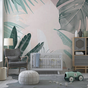 Green and pink tropical leaves wallpaper transforming children's playroom into botanical paradise