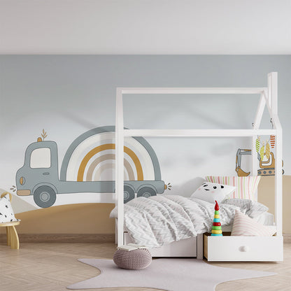 Kids-Mundo construction truck wall mural in a playroom with toy trucks and a reading nook.