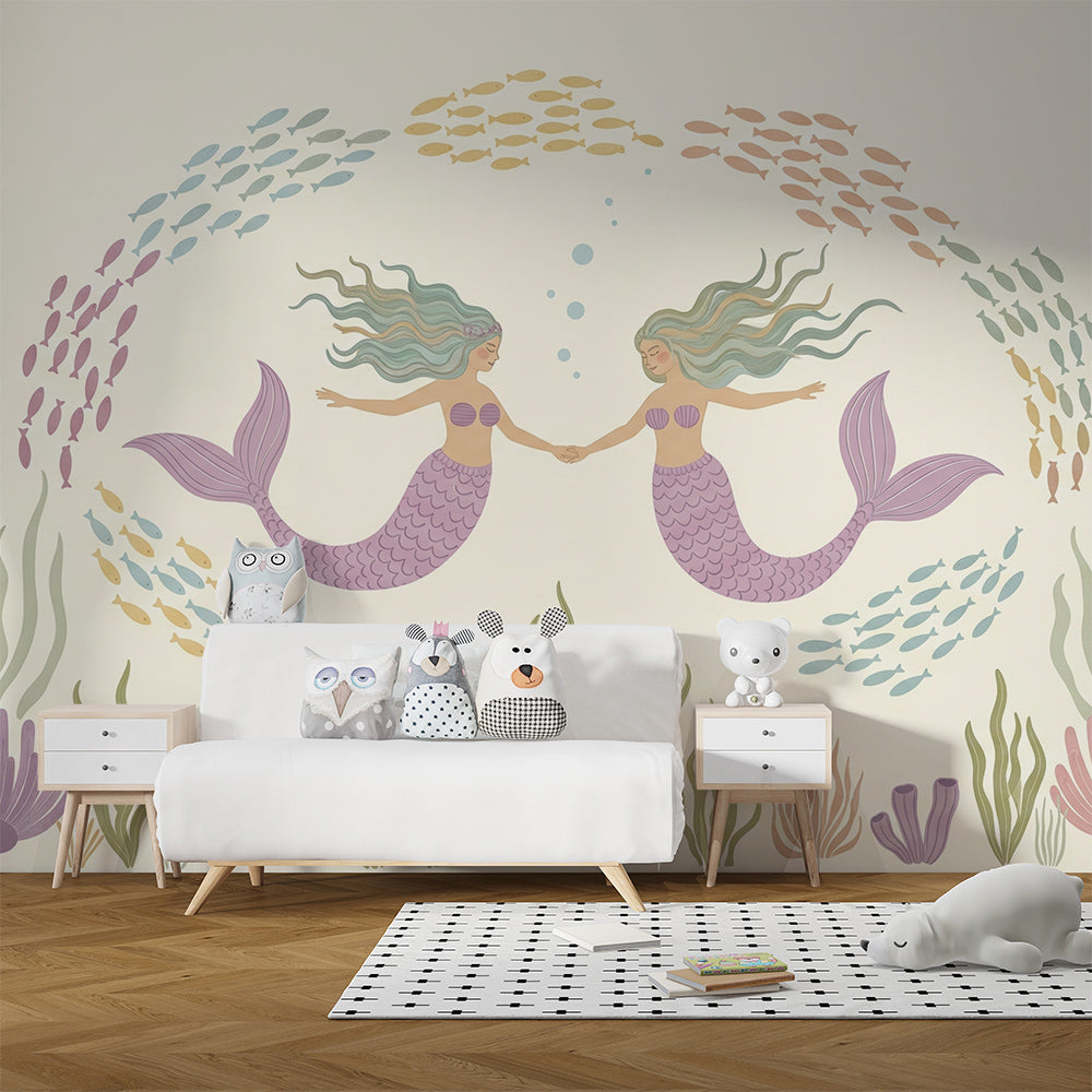 Kids-Mundo mermaid wall mural covering a kids bedroom wall behind a bed and cushions