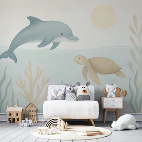Ocean themed mural wallpaper creating magical underwater atmosphere in kids bedroom