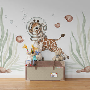 Ocean adventure mural wallpaper featuring astronaut giraffe in children's bedroom setting