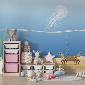 Underwater theme mural wallpaper creating serene ocean atmosphere in children's bedroom