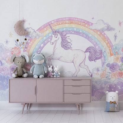 Kids-Mundo unicorn and rainbow cloud wall mural behind a bed in a soft kids bedroom
