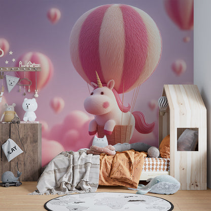 Kids-Mundo pink unicorn and balloon wall mural shown on a wall in a playroom