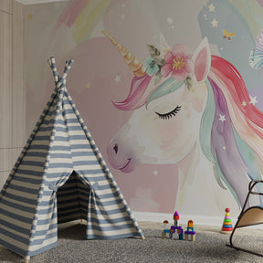 Magical unicorn wallpaper creating dreamy atmosphere in pink kids bedroom with butterfly motifs