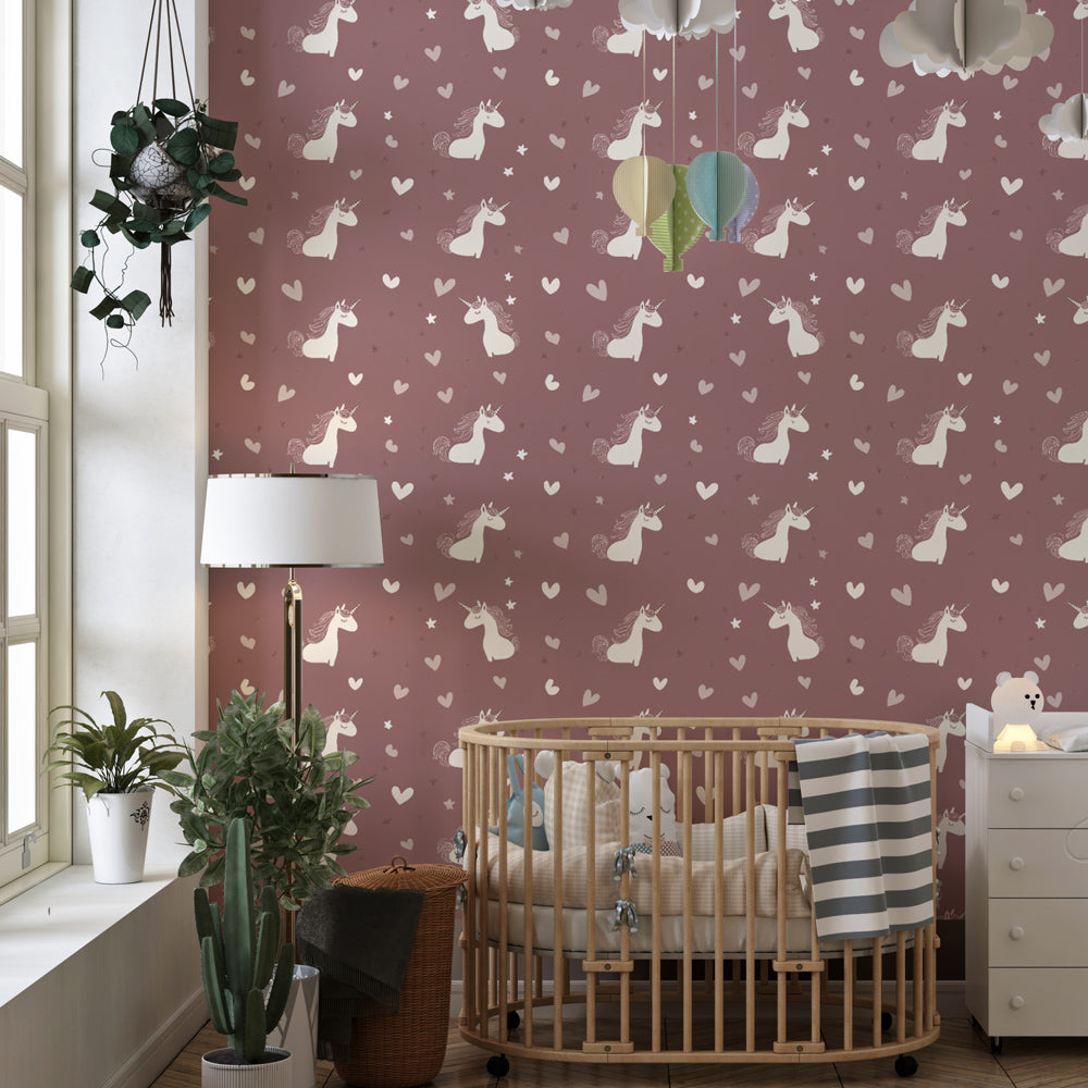 Magical unicorn wallpaper creating fairy-tale atmosphere in pink nursery room
