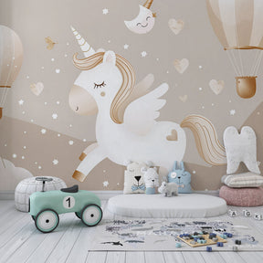 Whimsical unicorn mural wallpaper with floating balloons creating enchanting kids playroom atmosphere