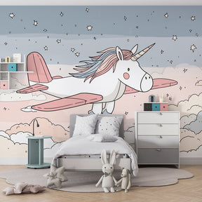Unicorn starry sky mural wallpaper in children's bedroom with pastel pink and blue colors