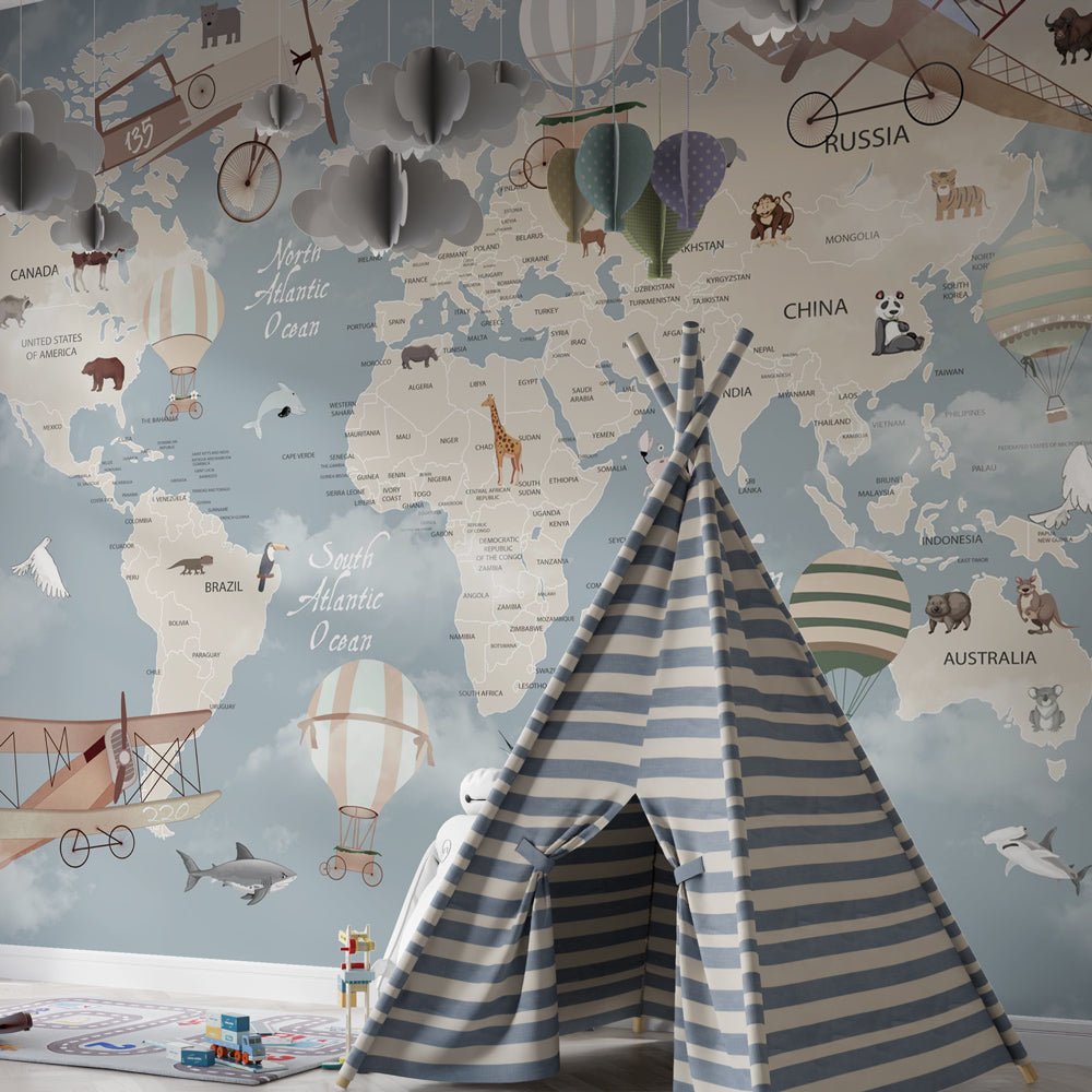 Kids-Mundo animal-themed world map mural in a playroom, striped balloons drifting above labelled oceans.