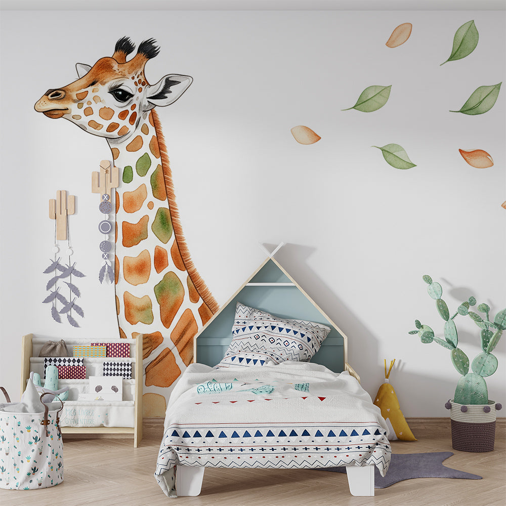 Kids-Mundo watercolour baby giraffe wall mural styled in a soft neutral nursery with a cot
