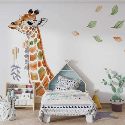 Kids-Mundo watercolour baby giraffe wall mural styled in a soft neutral nursery with a cot