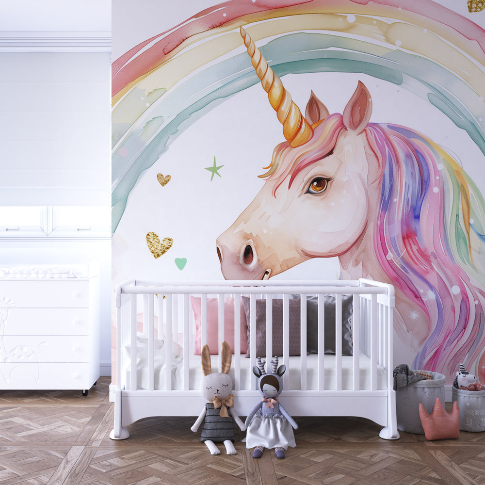 Kids-Mundo unicorn rainbow wall mural behind a bed in a girls bedroom with pink accents