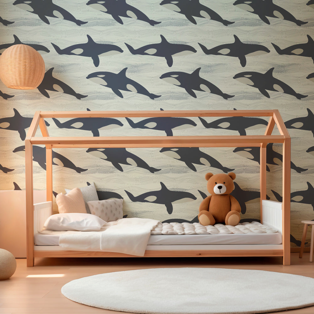 Orca whale wallpaper complementing coastal decor in kids room with natural wood elements