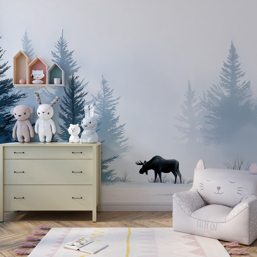 Snowy forest elk mural wallpaper with natural wood furniture in cozy kids room