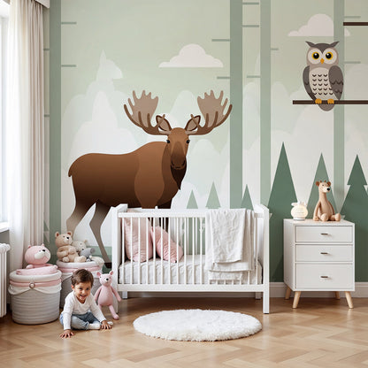 Kids-Mundo woodland moose, fox and owl wall mural styled behind a cot in a soft green nursery