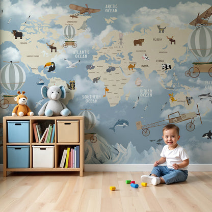 Kids-Mundo world map wall mural with animals and hot air balloons styled above a nursery cot