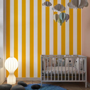 Bright yellow striped mural wallpaper adding energy to colorful children's playroom space