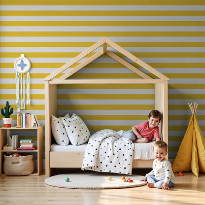 Kids-Mundo yellow and white stripe wall mural styled behind a cot in a sunny nursery