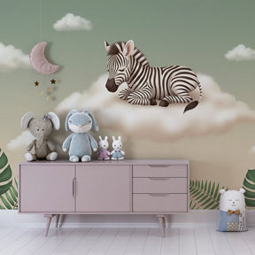 Close-up view of zebra on cloud mural wallpaper with tropical leaves in kids room